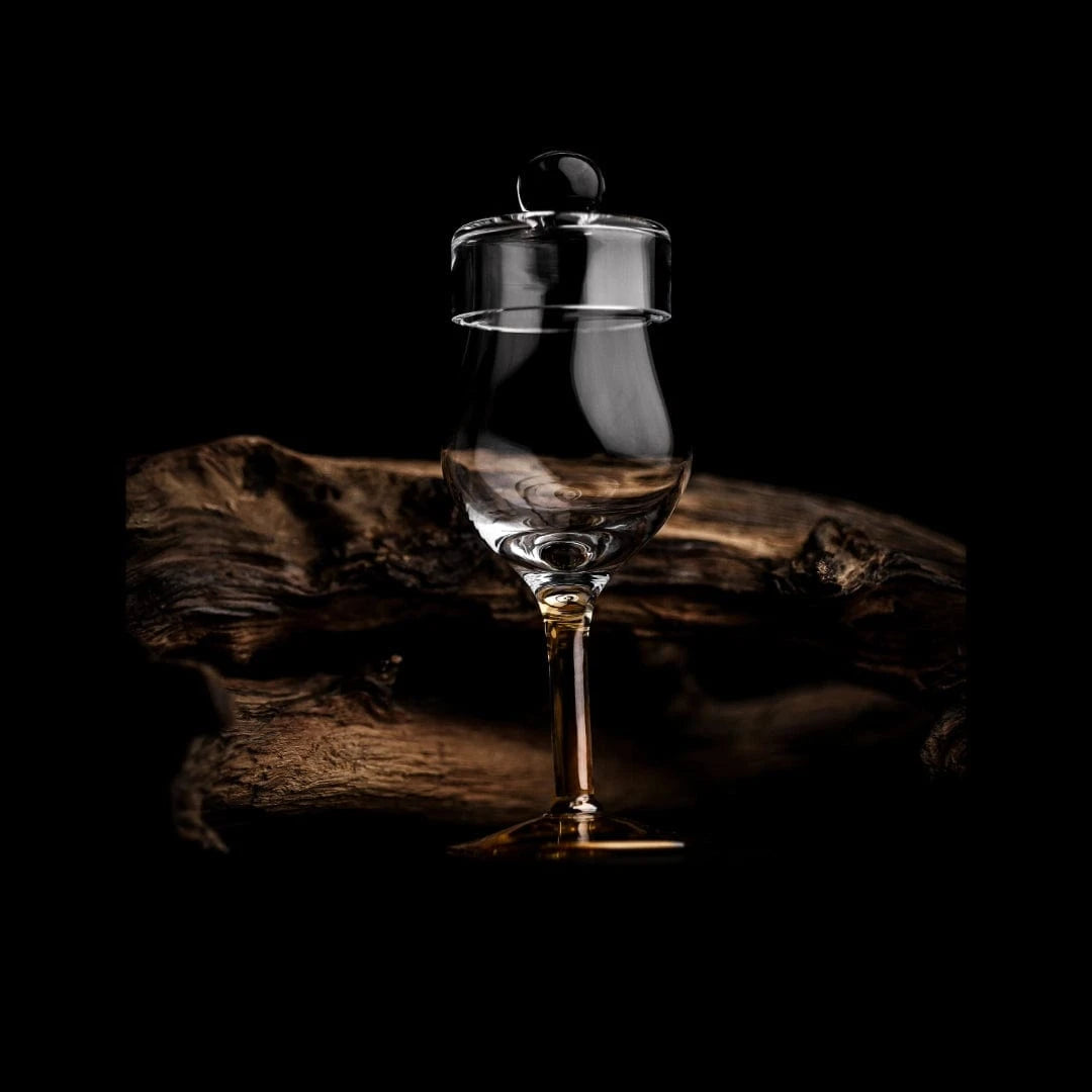 In this photo Whisky Glass G100 – 100 ml – with Lid – Hand-Blown – Amber Glass Mood4whisky